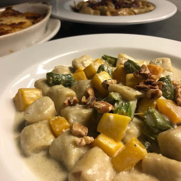 Cafe Gia's gnocchi with butternut squash, asparagus, and walnuts in a creamy sauce.